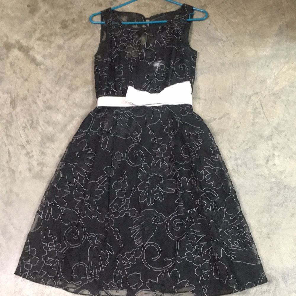 Black lace dress with white bow detail